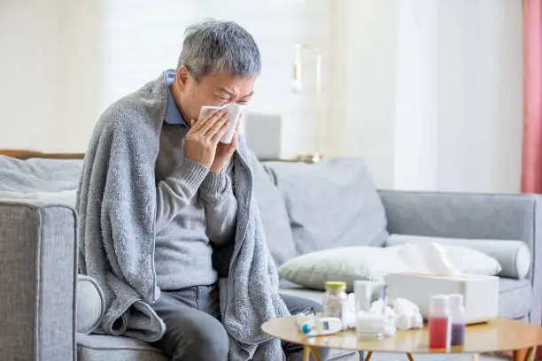 Photo of old asian man get a cold