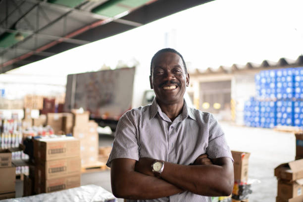 istock African mature man owner portrait at warehouse 1184189950