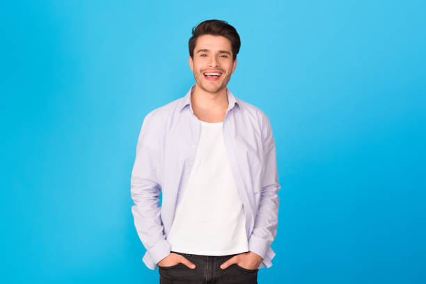 istock Casual man with hands in pockets, smiling to camera 1184190008