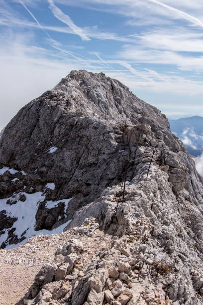 istock Narrow dangerous path towards Triglav peak 1184190260