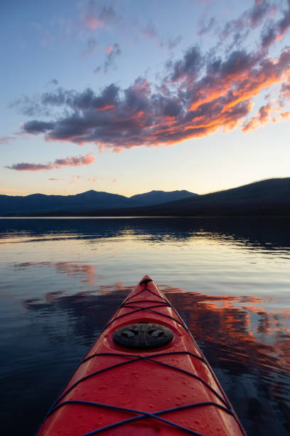 kayaking in glacier national park - dusk blue montana landscape imagens e fotografias de stock