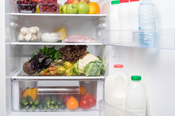 istock fruits, vegetables and meat inside the refrigerator, background, close-up 1184194221