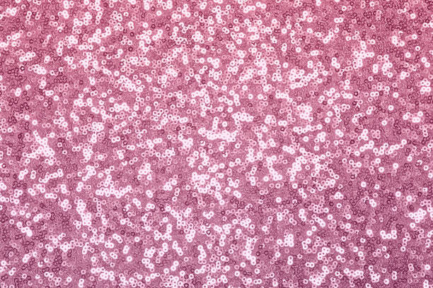 istock Sparkling pink, lilac sequin textile background. Fashion fabric glitter, sequins 1184194583