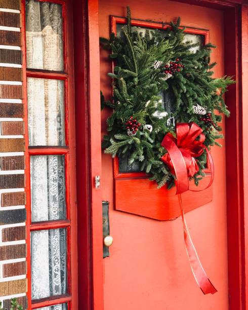 istock Christmas Wreath on Red Door 1184194858
