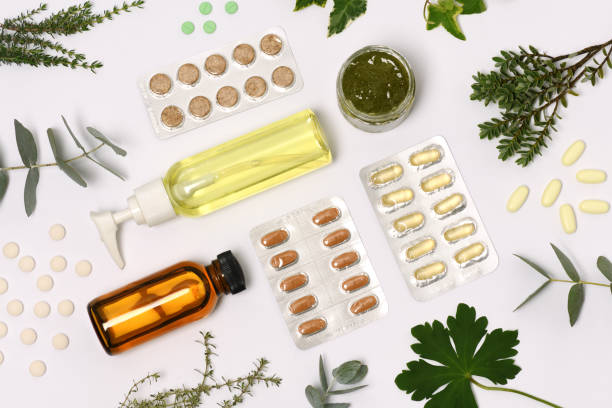 istock natural cosmetics with pills and plants 1184196510