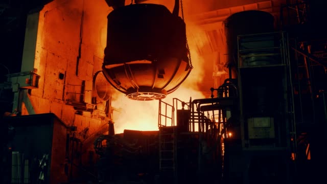 Metallurgical plant - the furnace is filled with scrap metal