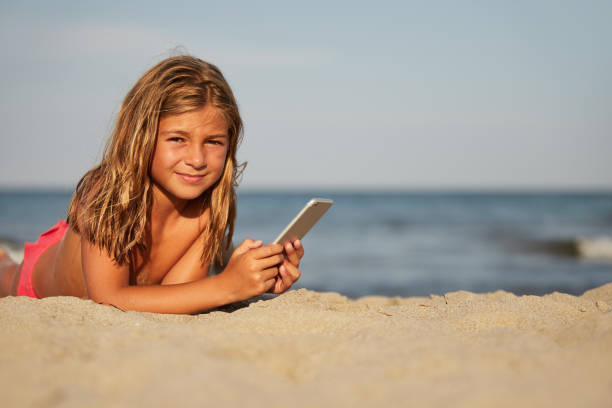 istock Little girl on the beach 1184197273