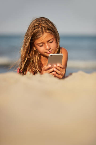 istock Little girl on the beach 1184197288