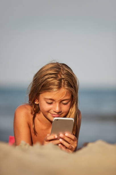 istock Little girl on the beach 1184197320