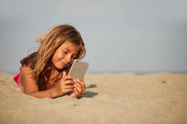istock Little girl on the beach 1184197322