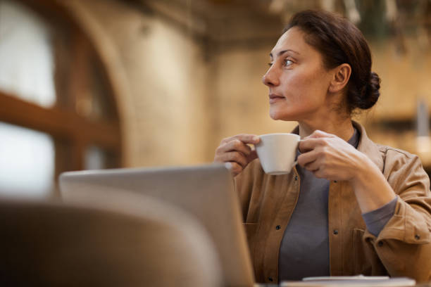 istock Businesswoman with cup of coffee 1184199092