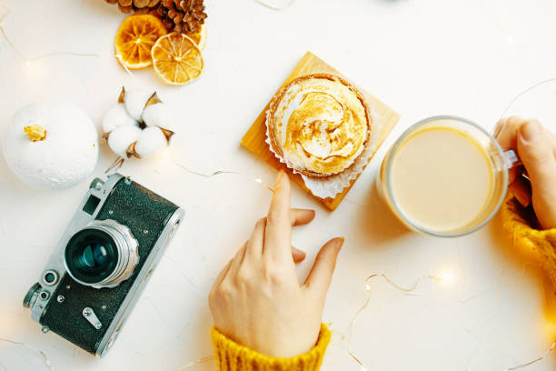istock Coffee and cake with cream on the table. 1184200146