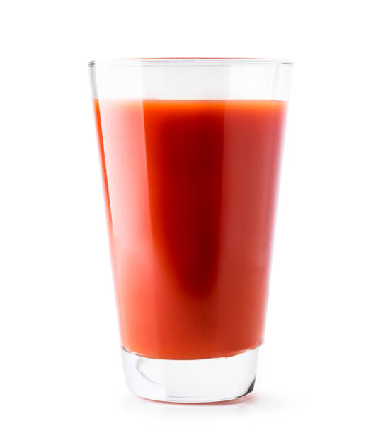 istock Tomato juice in a glass close-up on a white. Isolated. 1184200285