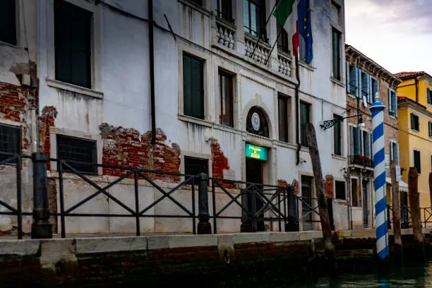 Photo of Old police station buildings on the side of a canal in Venice