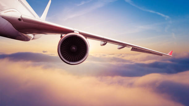 istock Commercial jet airplane flying above clouds 1184201938