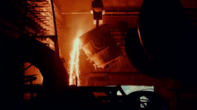 Steel mill factory - molten metal in vat