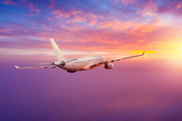 istock Passengers commercial airplane flying above clouds 1184201999