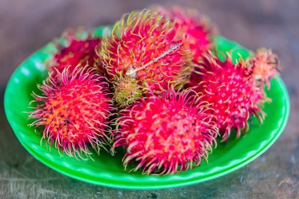 peeled Tropical fruit rambutan on white background