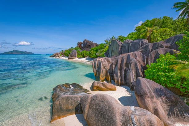 istock Beautiful tropical beach Anse Source d´Argent with sculpted granite rocks and palm trees - Island of La Digue, Seychelles, Indian Ocean Islands. 1184203996