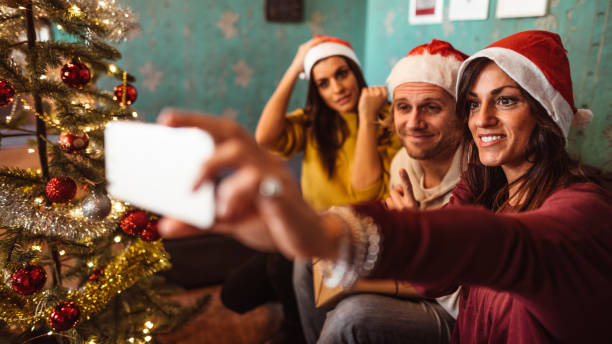 istock friends all together in the sofa take a selfie 1184204863