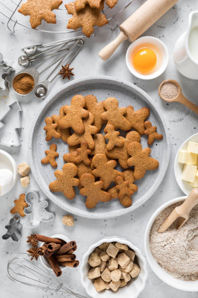 istock Christmas baking culinary background. Xmas gingerbread on kitchen table and ingredients for cooking festive cookies. New Year holiday decorations 1184206186