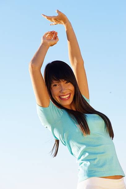istock Young woman with raised arms 118420721