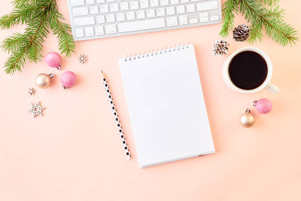 istock Mockup white notebook with spruce branche and keyboard, christmas decorations on a colored background 1184207400
