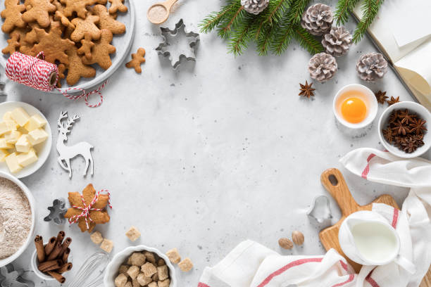 Christmas or Xmas baking culinary background. Ingredients for cooking on kitchen table. New Year or Noel holiday festive decorations