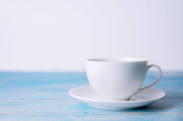 istock A cup of coffee on wooden background 1184209148