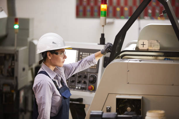 CNC machine operator preparing for work