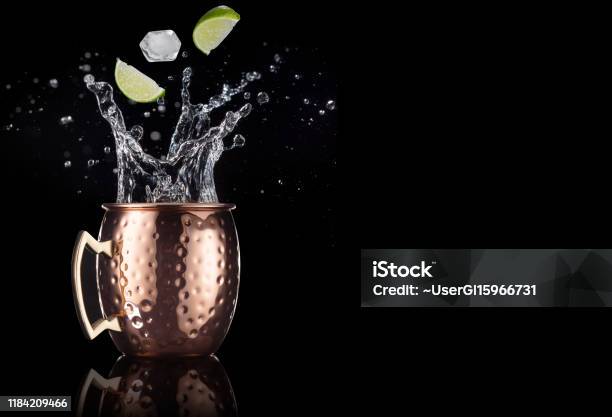 Moscow Mule Splashing On Black Background Stock Photo - Download Image Now - Moscow Mule, Mule, Cocktail