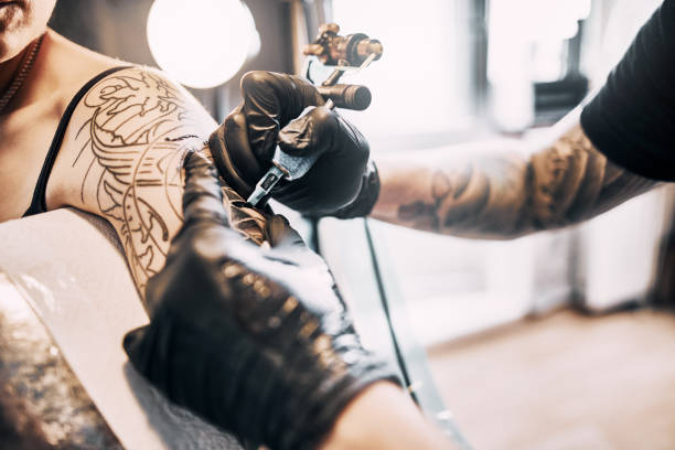 istock Tattooing a shoulder. Close-up shot 1184211229