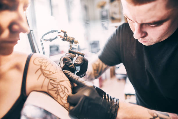 istock Tattooing a shoulder. Close-up shot 1184211286