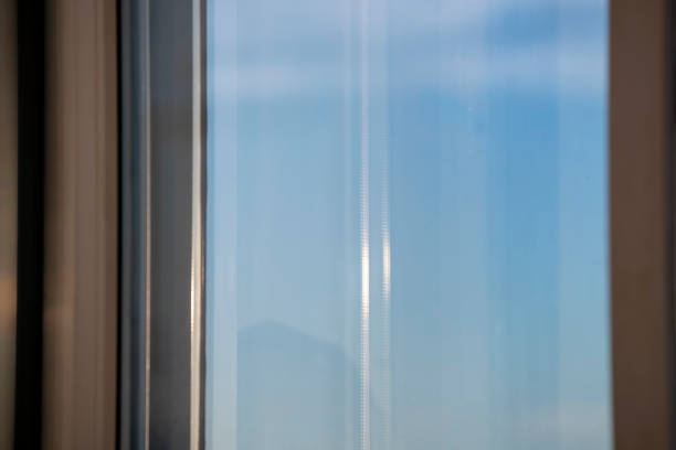 istock Double glazed PVC window sun light on the glass 1184213202