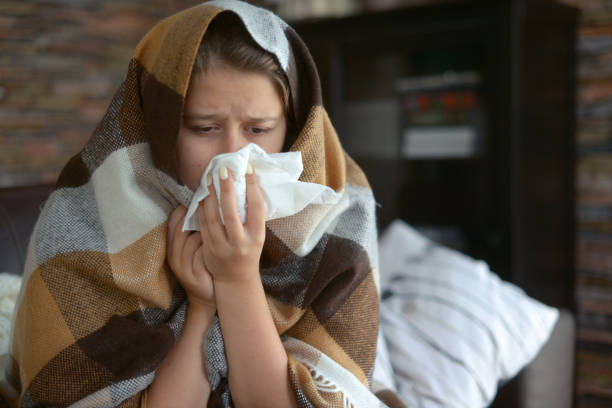 istock young girl is sick in the room 1184214582