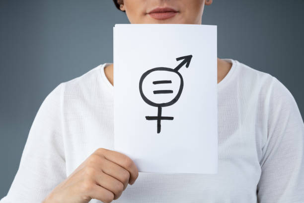 istock Women Holding Gender Equality Sign 1184215938