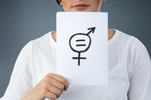 Women Holding Paper With Gender Equality Sign