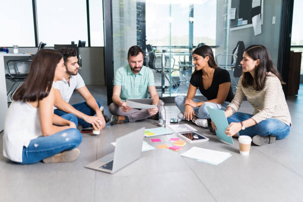 istock Leader Planning With Coworkers At Coworking Workplace 1184216115