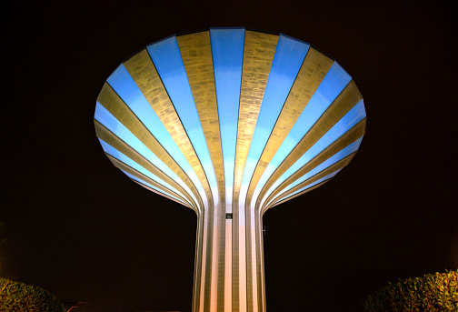 Riyadh, Saudi Arabia: water tower at night, built in 1971 with a filling capacity of 12,000 cubic meters, its design, resembles a cocktail glass - until 2000, when the Al Faisaliyah Tower was built, this was Riyadh's tallest landmark - cylindrical shaft with a conical tank - Al-Watan Park, Wazir Street  / King Saud Rd, Al Futah