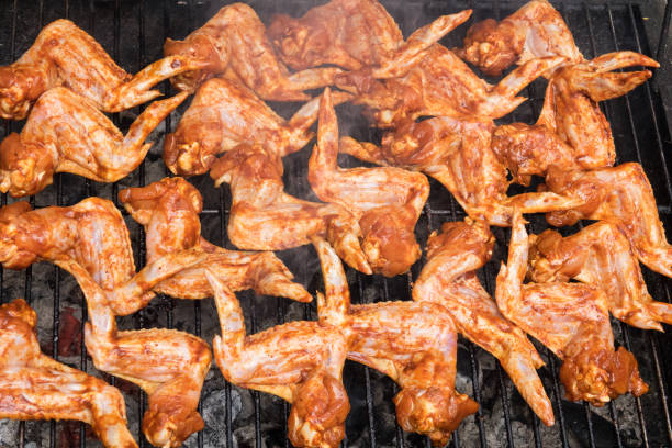 istock Grilling spicy chicken wings on barbecue grill. 1184218618