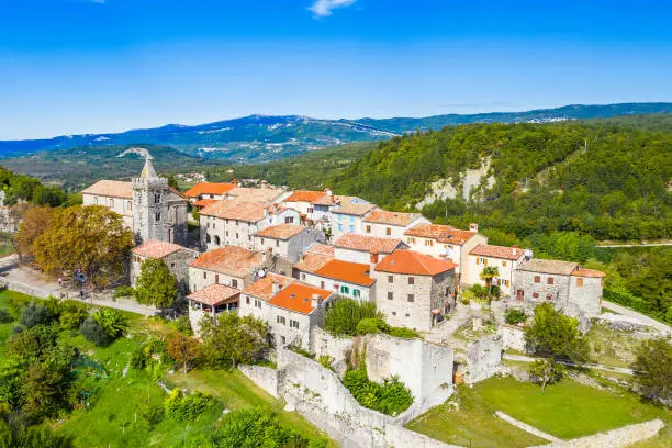 Old town of Hum on the hill, beautiful traditional architecture in Istria, Croatia, aerial view from drone