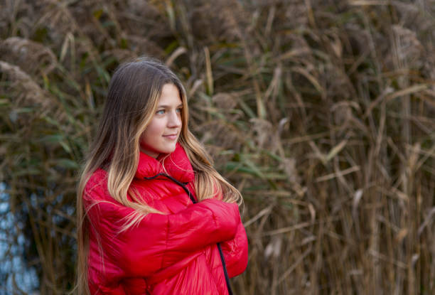 istock girl in red jacket 1184219806