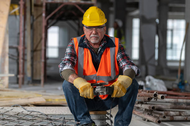 istock Portrait of a senior construction worker holding an angle grinder 1184220859