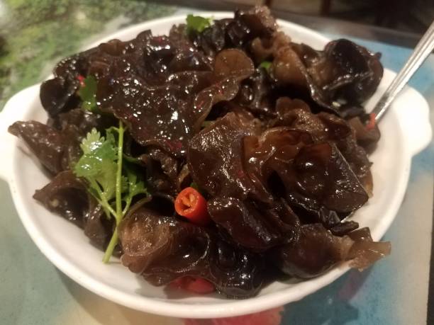 istock spicy Chinese mushroom with peppers in dish 1184225464