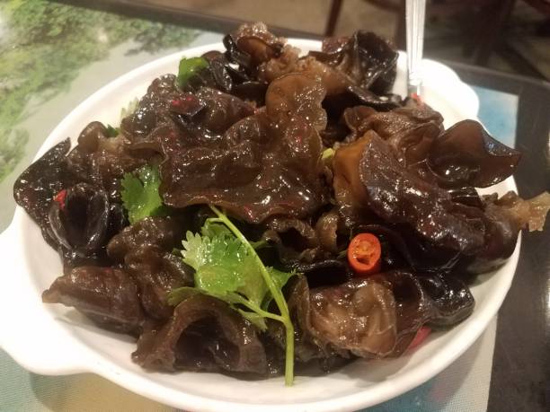 istock spicy Chinese mushroom with peppers in dish 1184225466