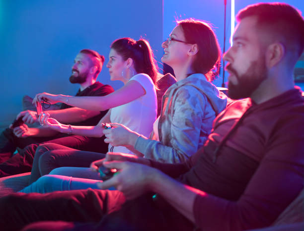 istock Two teams playing video game in entertainment center 1184225586