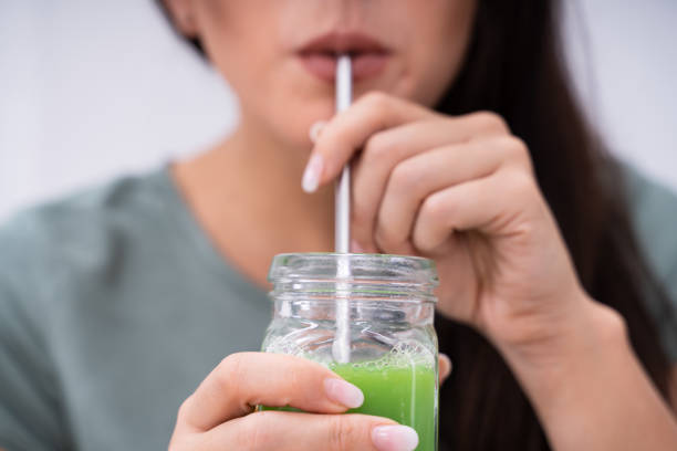 Woman Drinking Organic Smoothie stock photo