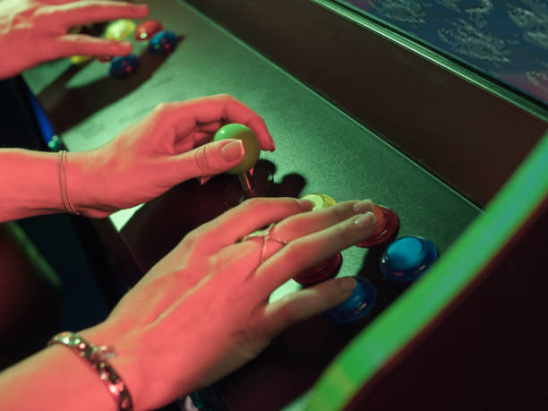 istock Two adults playing game in video arcade 1184225992