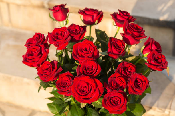 istock bouquet of blossoming dark red roses 1184226260