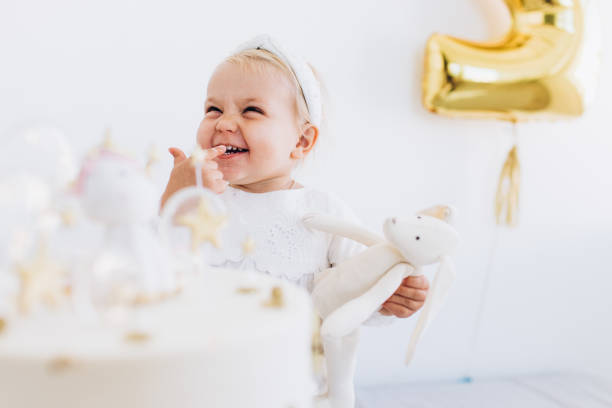 istock The child eats cake with appetite. Birthday baby. 1184227121